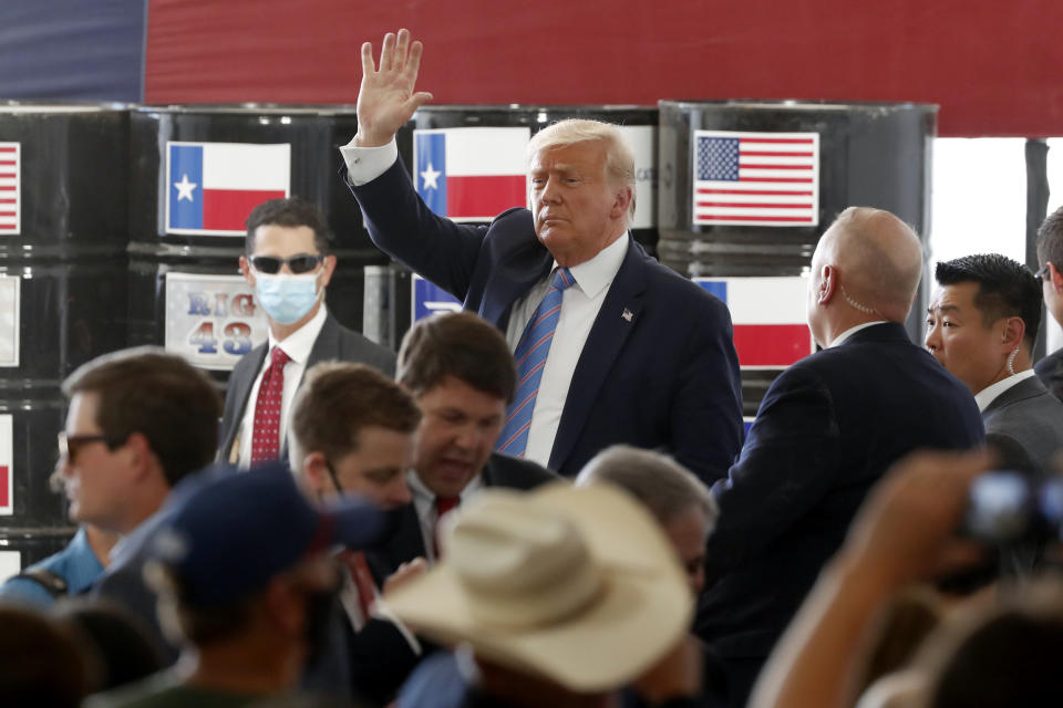 President Donald Trump waves to supporters after delivering remarks about American energy production during a visit to the Double Eagle Energy Oil Rig, Wednesday, July 29, 2020, in Midland, Texas. (AP Photo/Tony Gutierrez)
