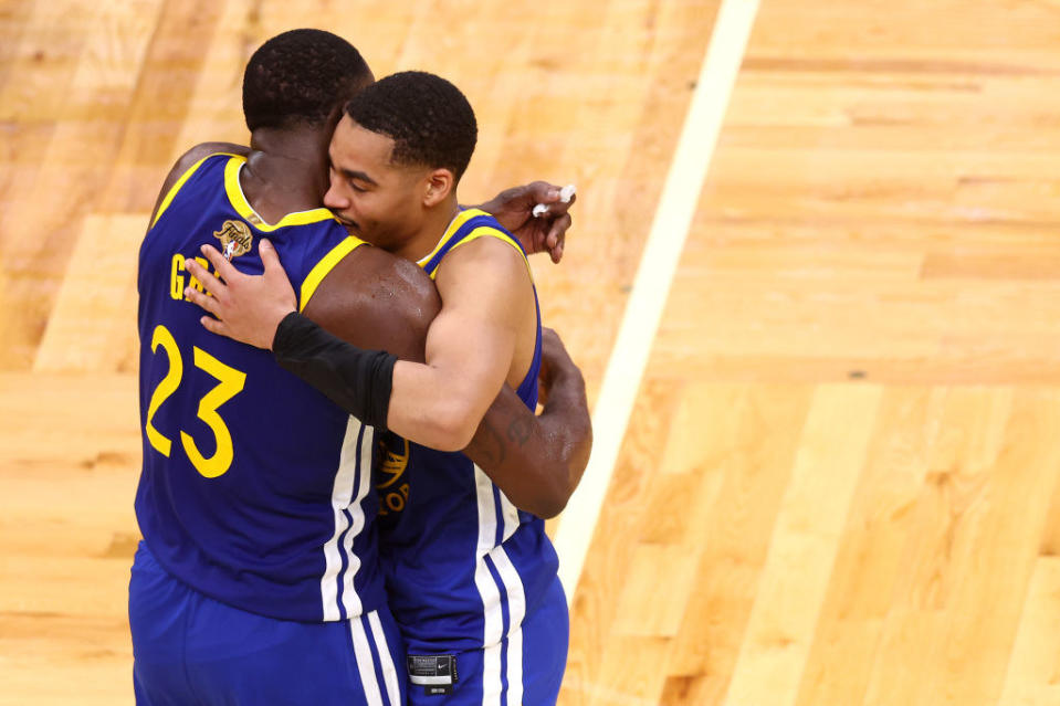 Jordan Poole #3 and Draymond Green #23 of the Golden State Warriors celebrate against the Boston Celtics