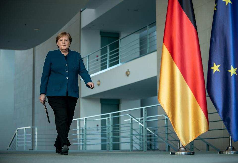 German Chancellor Angela Merkel arrives to make a press statement on the spread of the new coronavirus COVID-19 at the Chancellery, in Berlin on March 22, 2020. - German Chancellor Angela Merkel is going in to quarantine after meeting virus-infected doctor according to her spokesman on March 22, 2020. (Photo by Michael Kappeler / AFP) (Photo by MICHAEL KAPPELER/AFP via Getty Images)