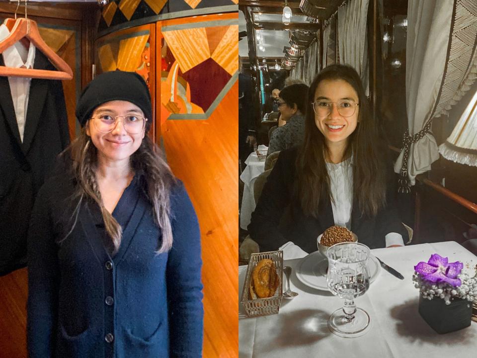 Left: The author stands in front of a red wooden wall with painted details. Right: The author in a suit sits at a white-clothed dining table holding a lamp, flowers, a glass of water, and a dessert dish.