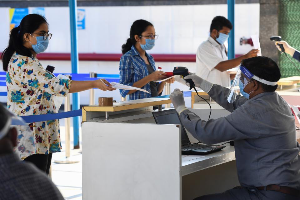 Students arrive at an examination centre for Joint Entrance Examination (JEE ) Main-2020, one of the most competitive entrance exams for entry to top national engineering colleges, in Noida on September 1, 2020. (Photo by PRAKASH SINGH/AFP via Getty Images)