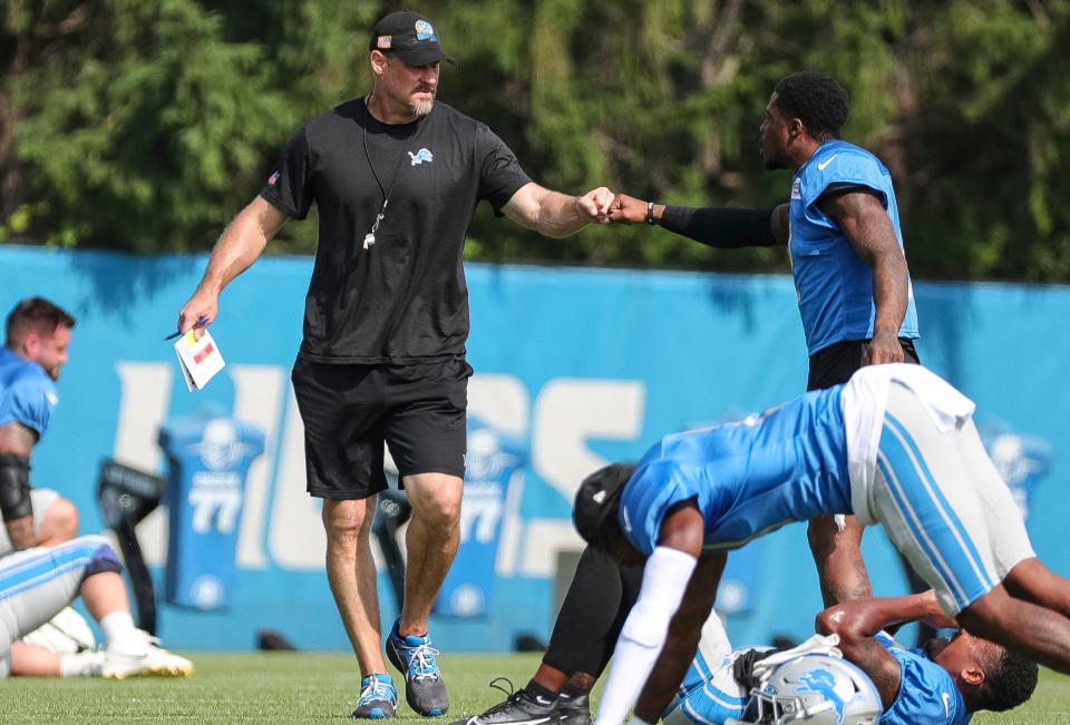 Detroit Lions head coach Dan Campbell shakes hands with safety C.J. Gardner-Johnson during joint practice with New York Giants at Detroit Lions headquarters and training facility in Allen Park on Tuesday, August 8, 2023.