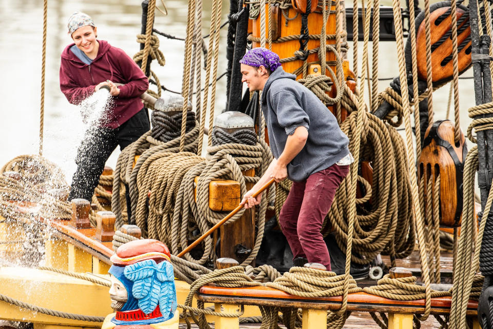 Workers clean the Kalmar Nyckel, the Tall Ship of Delaware, as seen from the Copeland Maritime Center on Friday, March 24, 2023.