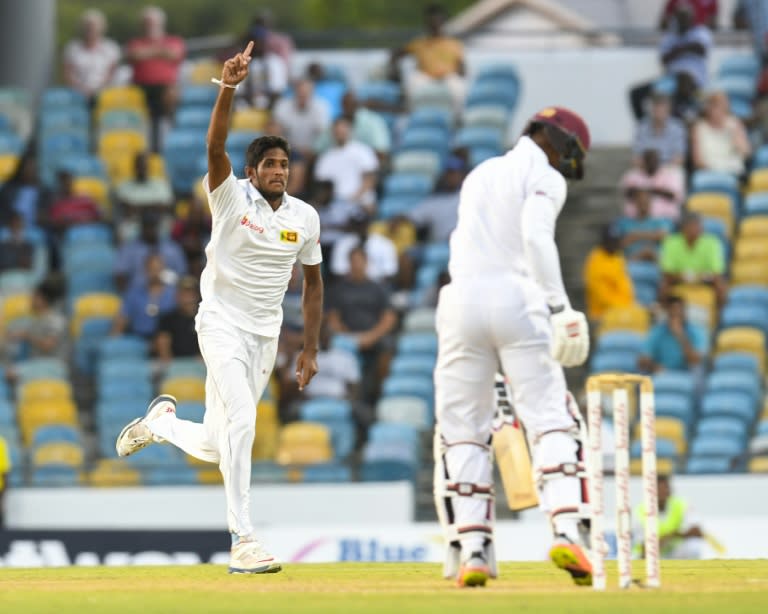 Kasun Rajitha (L) of Sri Lanka celebrates the dismissal of Shai Hope of West Indies on Day 1 of their 3rd Test, at Kensington Oval in Bridgetown, Barbados, on June 23, 2018