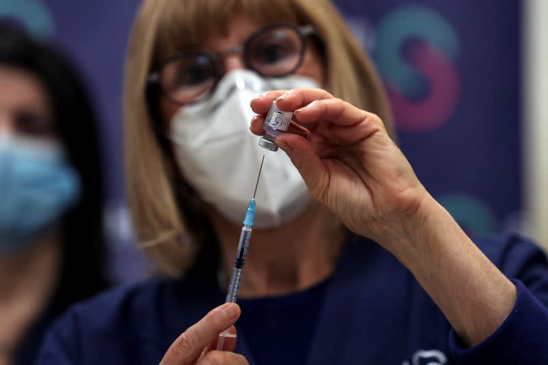 FILE PHOTO: A nurse prepares a fourth dose of coronavirus disease (COVID-19) vaccine as part of a trial in Israel, as Health Ministry is considering offering the second booster to the elderly and immunocompromised, at Sheba Medical Center in Ramat Gan