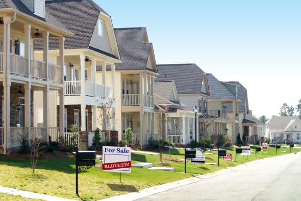 Row of nice homes on a street, all of them for sale