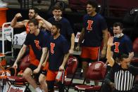 The Illinois bench reacts after a basket during the second half of an NCAA college basketball game against the Wisconsin Saturday, Feb. 27, 2021, in Madison, Wis. (AP Photo/Morry Gash)