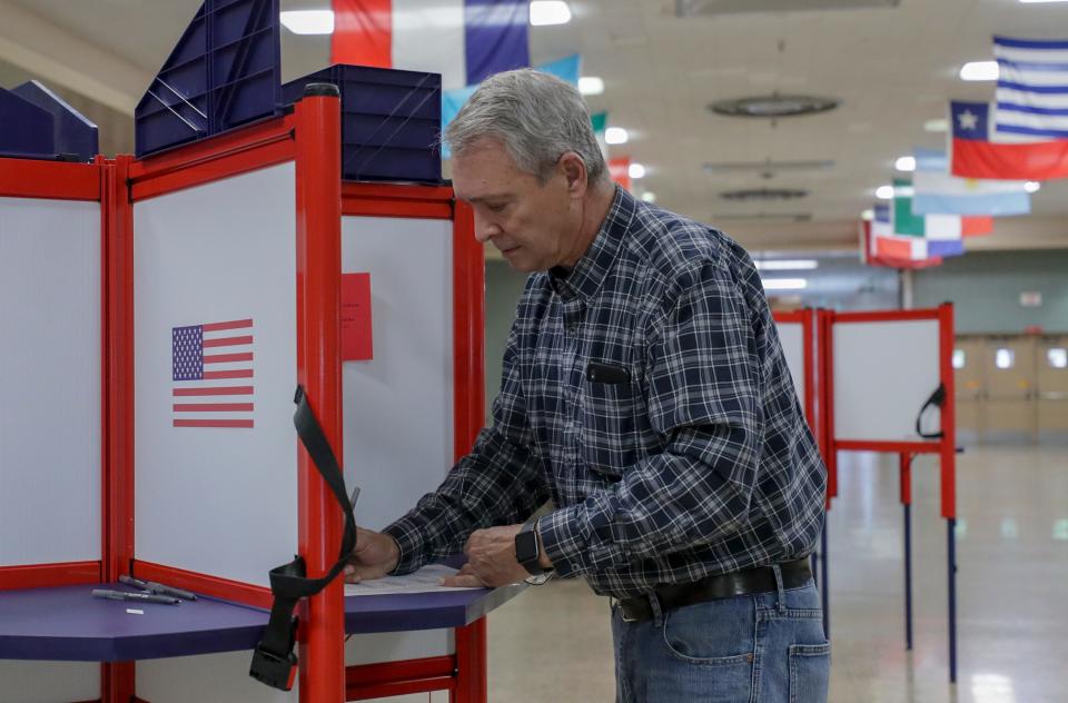 Ralph Merkel fills out his ballot at Atherton High School in Louisville, Ky., on May 21, 2019.