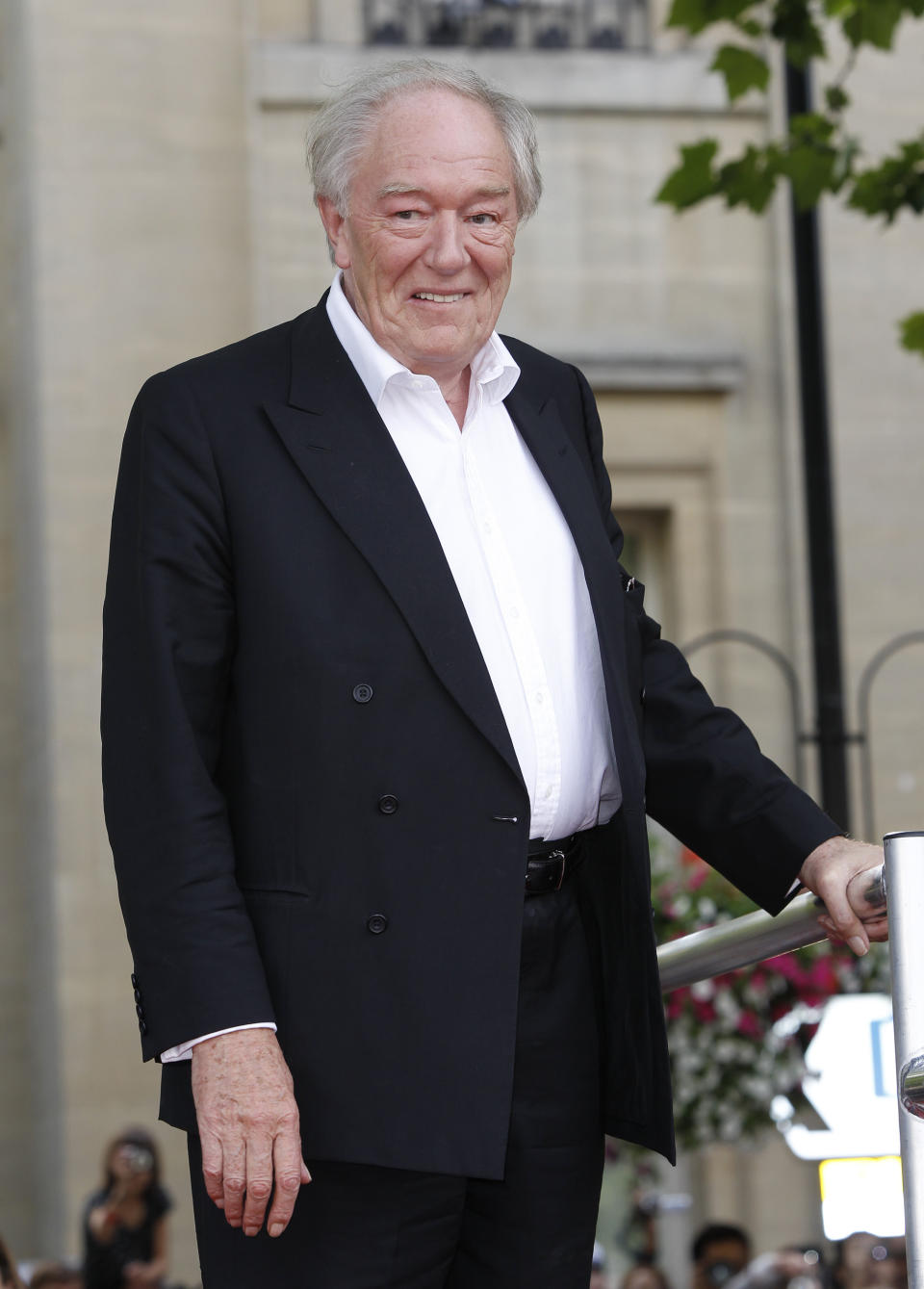 FILE - British actor Michael Gambon arrives in Trafalgar Square, in central London, for the world premiere of "Harry Potter and The Deathly Hallows: Part 2," the last film in the series, on July 7, 2011. Gambon, who was known to many for his portrayal of Hogwarts headmaster Albus Dumbledore in six of eight “Harry Potter” films, died. He was 82. A statement by his family, issued by his publicist on Thursday, Sept. 28, 2023, said he died following “a bout of pneumonia.” (AP Photo/Joel Ryan, File)