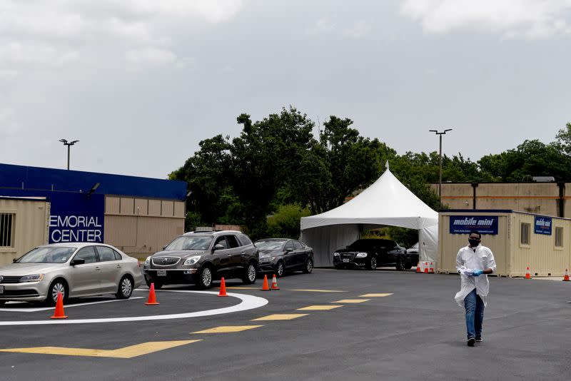 People wait in long lines for COVID-19 testing in Houston