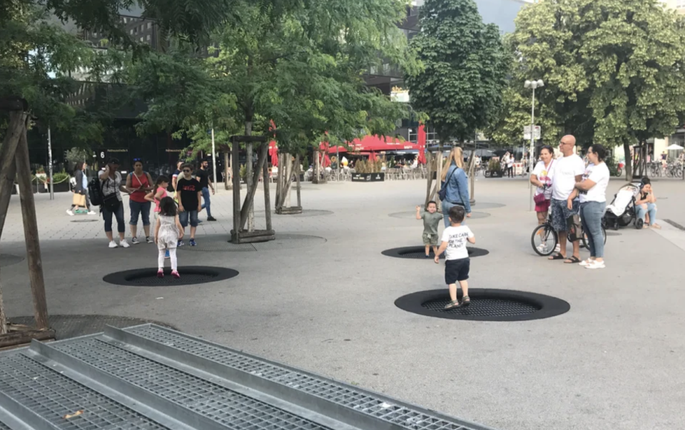 Kids on in-ground trampolines