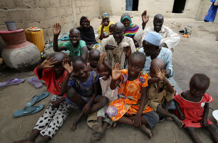 Bukar Abdilkadir with his eight children, two wivies, mother and octogenarian father seen after two weeks on arrival at the IDP camp at Banki, Borno, Nigeria April 26, 2017. Picture taken April 26, 2017. REUTERS/Afolabi Sotunde