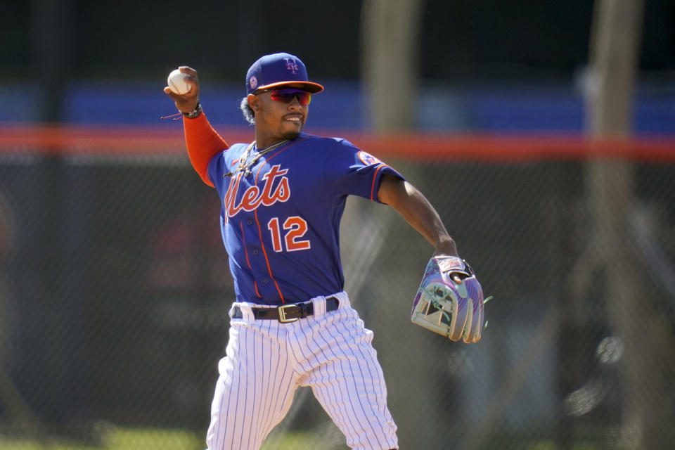 New York Mets infielder Francisco Lindor throws during spring training baseball practice Tuesday, Feb. 23, 2021, in Port St. Lucie, Fla. (AP Photo/Jeff Roberson)