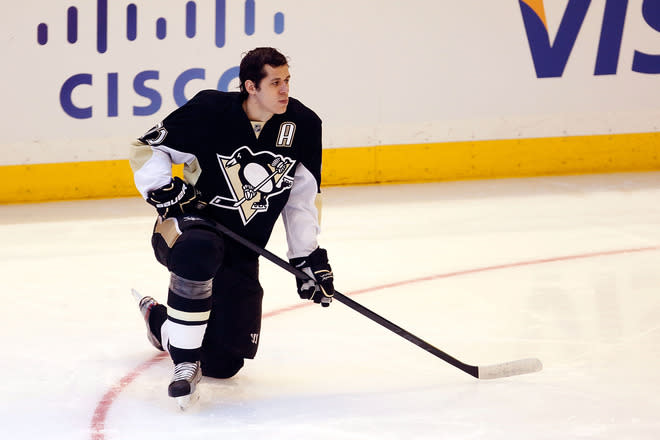 OTTAWA, ON - JANUARY 28: Evgeni Malkin #71 of the Pittsburgh Penguins and Team Chara kneels on the ice during the 2012 Molson Canadian NHL All-Star Skills Competition at Scotiabank Place on January 28, 2012 in Ottawa, Ontario, Canada. (Photo by Gregory Shamus/Getty Images)