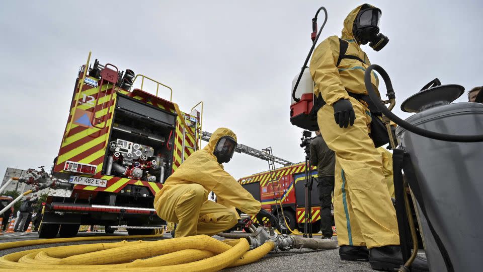 Rescuers attend an anti-radiation drill on June 29, in case of an emergency at the ZNPP. - Stringer/Reuters