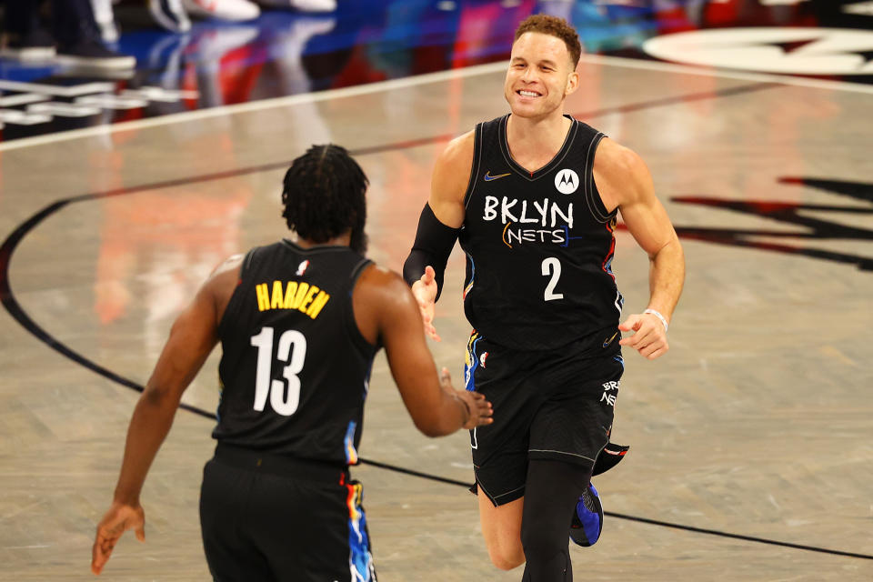 Blake Griffin of the Brooklyn Nets celebrates his dunk with James Harden