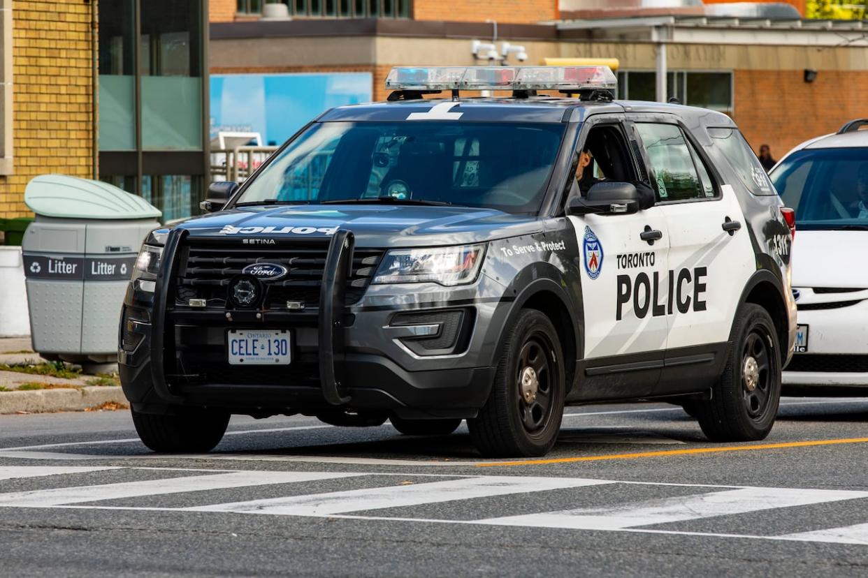 A Toronto Police cruiser is shown here at on Glencairn Avenue crossing Bathurst Street on Oct. 12, 2023. (Michael Wilson/CBC - image credit)