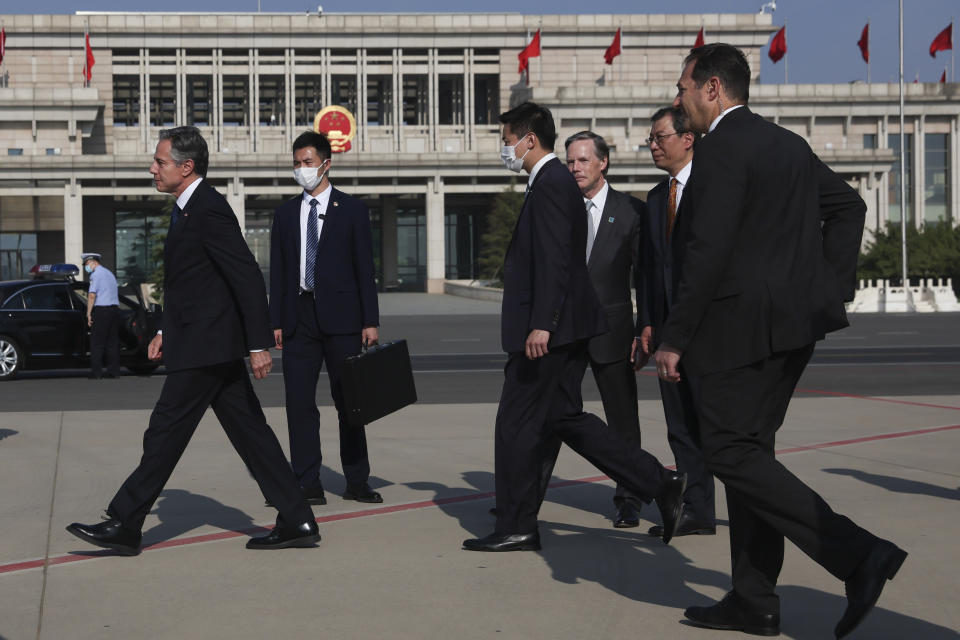 U.S. Secretary of State Antony Blinken, left, walks after arriving in Beijing, Sunday, June 18, 2023. (Leah Millis/Pool Photo via AP)