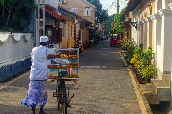Local vendor selling cakes from his bike. Photo: Skye Gilkeson