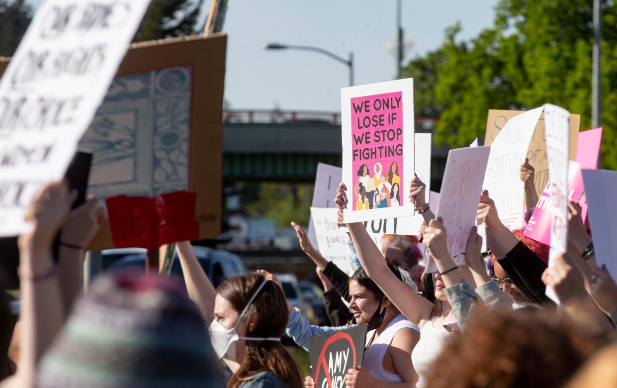 Protesters gather along the roadside at the federal courthouse in Eugene during May 2022 rally in support of abortion rights.