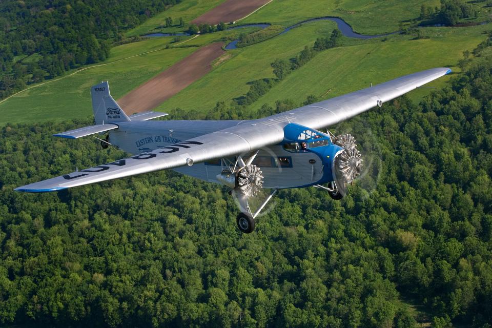 The Experimental Aircraft Association's Ford Tri-Motor flies near its home base in Oshkosh, Wisconsin