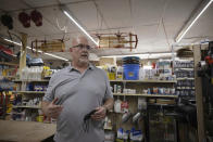 Craig Bratcher, a Boone County commissioner, speaks with an Associated Press reporter inside Byrnside Hardware in Danville, W.Va., on Tuesday, Oct. 13, 2020. Bratcher, who describes himself as a moderate, wouldn't say who he’ll vote for in the presidential election, but he offered a forgiving assessment of President Donald Trump. “He’s come in and he’s tried,” he said. “I’ll give him this.” (AP Photo/Chris Jackson)