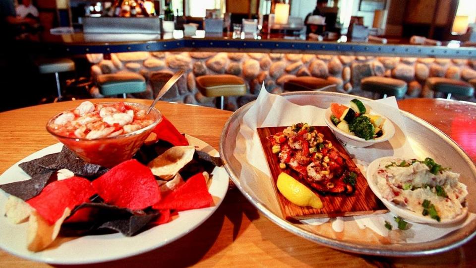 A “shrimo martini” and cedar-plank salmon at Rockfish Seafood’s Arlington location.