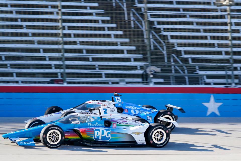 Graham Rahal (15) attempts to pass Josef Newgarden (2) during the final practice round of an IndyCar Series auto race at Texas Motor Speedway in Fort Worth, Texas, Saturday, March 19, 2022. (AP Photo/Randy Holt)