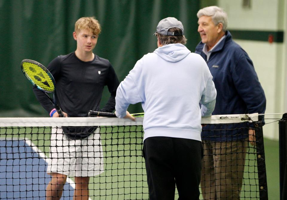 David Filer, far left, speaks with his coach, Doug Gossman, center, and friend Dan Bigg Monday, Jan. 16, 2023, at the South Bend Racquet Club.