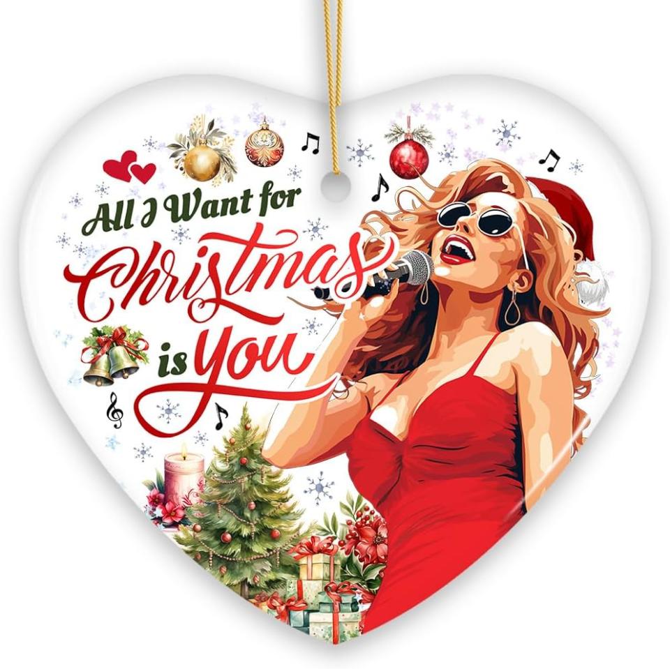 white heart-shaped ornament with graphic of mariah carey