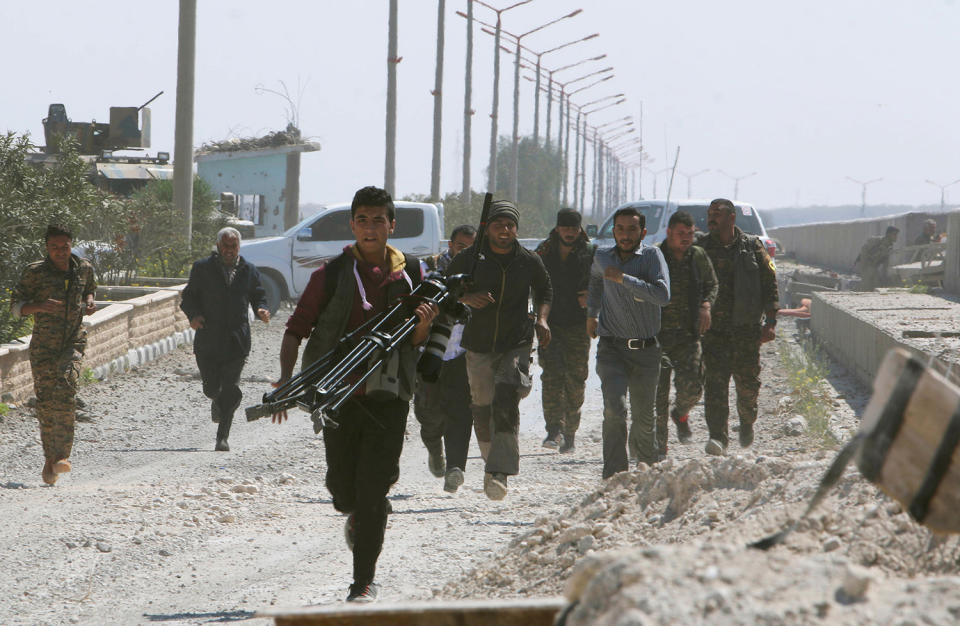 Running for cover from Islamic State shelling