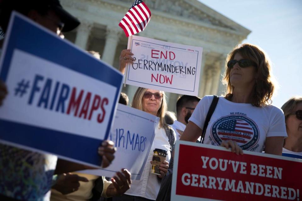 Demonstrators outside the U.S. Supreme Court building in October 2017 as justices heard arguments in a key gerrymandering case. A new case, Moore v. Harper, was before the court Dec. 7, 2022. It could further loosen rules for politicians to gerrymander their districts.