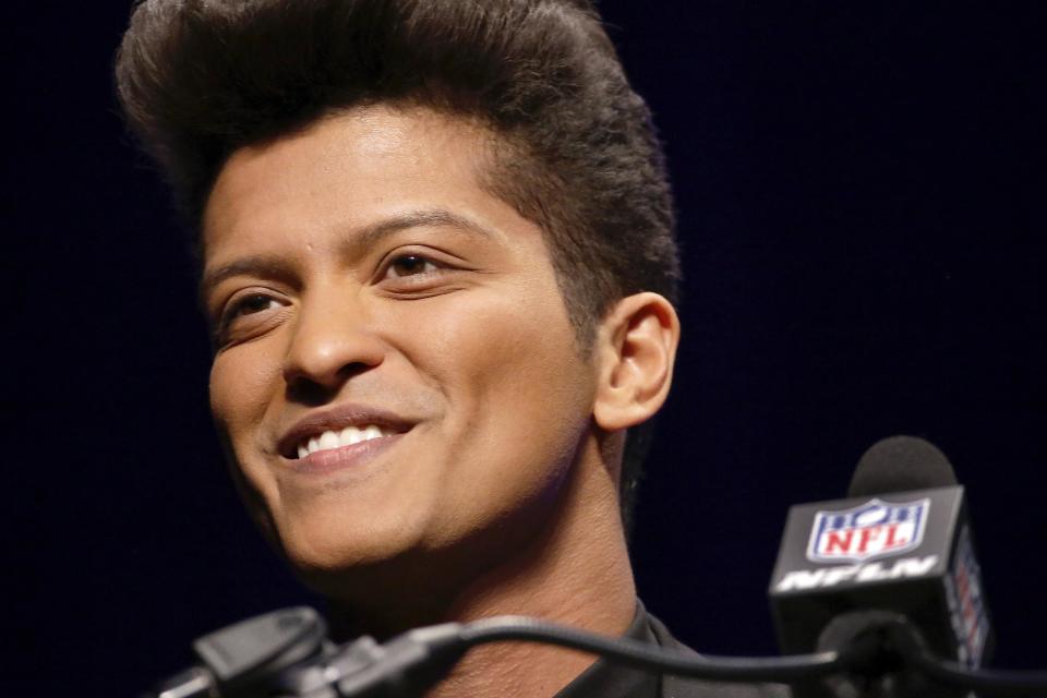 Bruno Mars who will headline the half-time show at the NFL Super Bowl XLVIII football game speaks during a press conference Thursday, Jan. 30, 2014, in New York. (AP Photo)