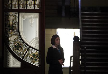 A woman stands in the lobby of the Liszt Academy music school in Budapest October 21, 2013. REUTERS/Laszlo Balogh