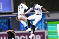 Miami Marlins' Jazz Chisholm Jr. (2) and Lewis Brinson, right, celebrate after a baseball game against the New York Mets, Thursday, Aug. 5, 2021, in Miami. The Marlins won 4-2. (AP Photo/Lynne Sladky)