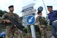 <p>Italian soldiers and police stand at a checkpoint at a road leading up to the historic town of Taormina, which will host the upcoming G7 summit, on the island of Sicily on May 23, 2017 in Taormina, Italy. (Photo: Sean Gallup/Getty Images) </p>