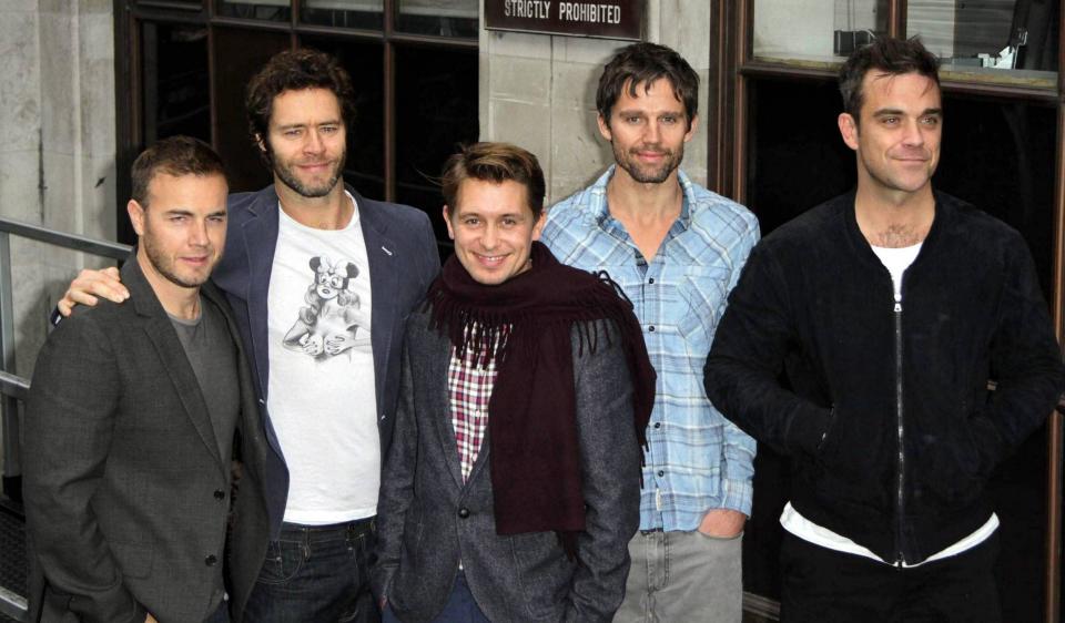 Robbie Williams, 36, shows off some grey hair as he arrives with his Take That bandmates for an interview at BBC Radio 1. The interview follows the group's announcement that they will be touring next year, currently scheduled to play 14 dates in the UK. The tour, Progress Live 2011 will be in promotion of their new album 