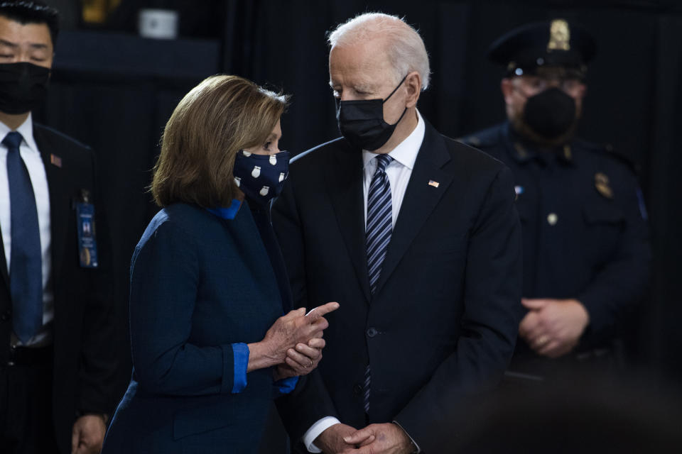 House Speaker Nancy Pelosi, D-Calif., speaks with President Joe Biden as they attend the service for U.S. Capitol Officer William "Billy" Evans, as his remains lie in honor in the Capitol Rotunda, Tuesday, April 13, 2021 in Washington. (Tom Williams/Pool via AP)