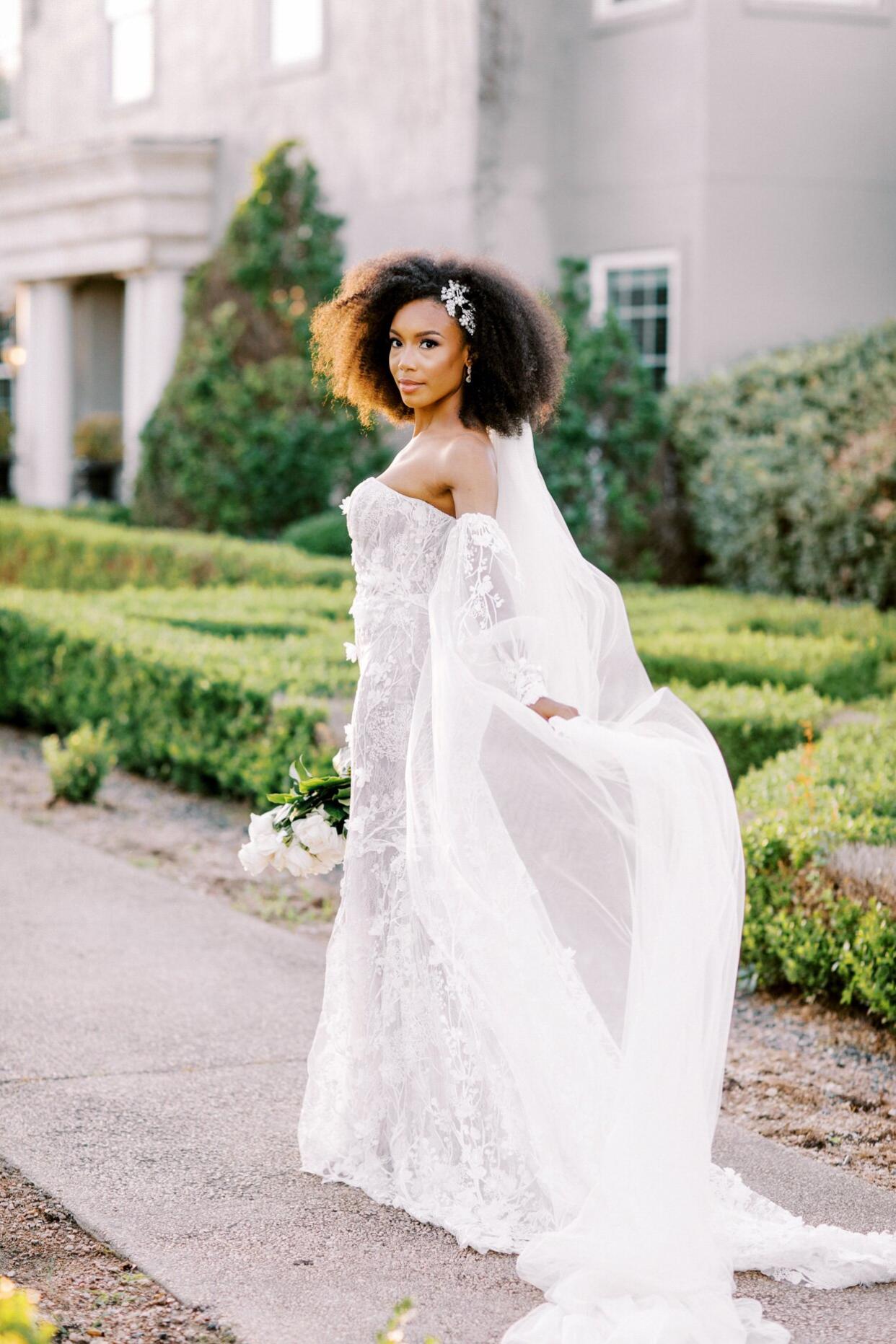 bride wearing strapless off-the-shoulder long sleeve wedding dress