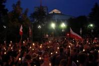 People attend candlelit rally against supreme court legislation in front of the Parliament building in Warsaw, Poland, July 20, 2017. Agencja Gazeta/Przemek Wierzchowski/via REUTERS