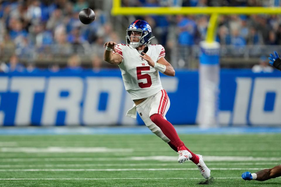 New York Giants quarterback Tommy DeVito (5) passes during the first half of an NFL preseason football game against the Detroit Lions, Friday, Aug. 11, 2023, in Detroit. (AP Photo/Paul Sancya)