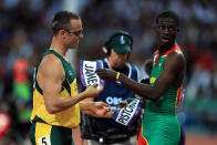 In a gesture of camaraderie and respect, Kirani James (R) of Grenada exchanges bibs with Oscar Pistorius (L) of South Africa after the Men's 400m semifinal on Day 9 of the London 2012 Olympic Games at the Olympic Stadium on August 5, 2012 in London, England. (Photo by Phil Walter/Getty Images)