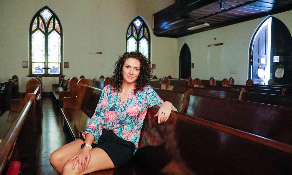 Samantha "Sam" Holvey sits inside Parkside Church just before the start of Good Friday service on April 7 in Charleston, S.C.