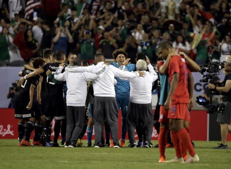 Mexico players celebrate after Mexico defeated United States 1-0 in the CONCACAF Gold Cup final soccer match at Soldier Field in Chicago, Sunday, July 7, 2019. (AP Photo/Nam Y. Huh)