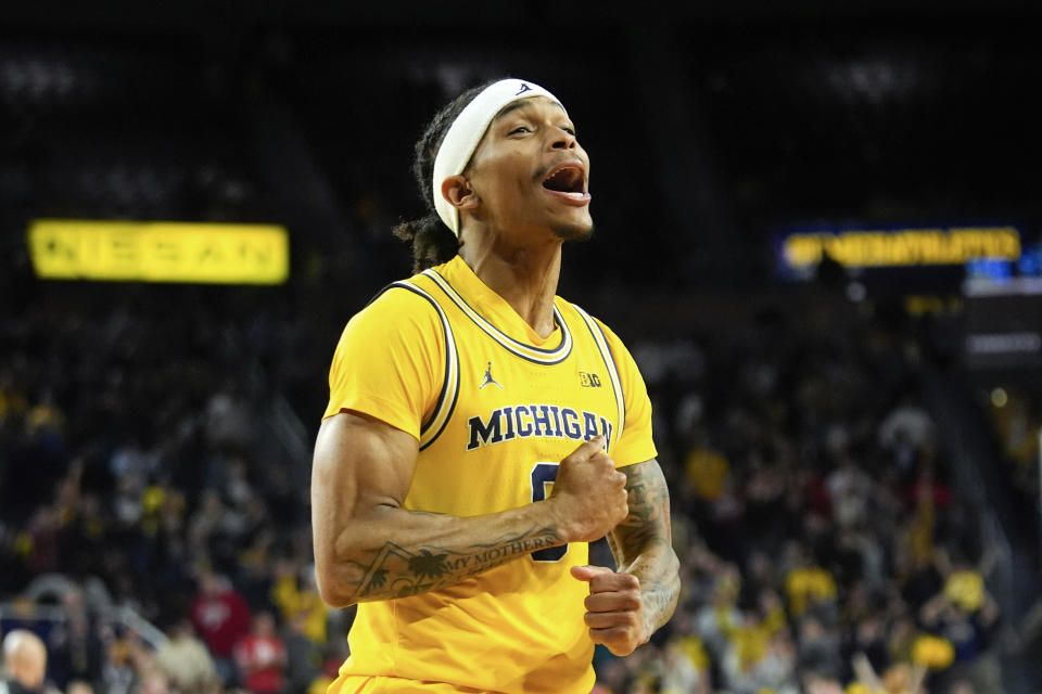 Michigan Wolverines guard Dug McDaniel (0) celebrates after beating Wisconsin in an NCAA college basketball game in Ann Arbor, Mich., Wednesday, Feb. 7, 2024. (AP Photo/Paul Sancya)