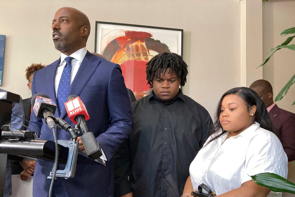 Attorney Cory Lynch, left, joined by Treveon Isaiah Taylor, Sr., Jessica Ross, speaks during a news conference, Wednesday, Aug. 9, 2023, in Atlanta, announcing a lawsuit against a doctor and Southern Regional Medical Center, a hospital south of Atlanta where Ross went on July 9 to have her son. A doctor used too much force and decapitated Ross's baby during delivery according to the lawsuit filed Wednesday, the attorneys said.