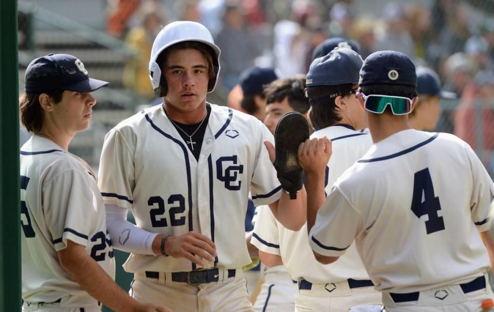 Central Catholic’s Kayden McHenry enters the dugout after scoring a run during a Valley Oak League matchup with Manteca at Manteca High School on Friday, April 26, 2024.