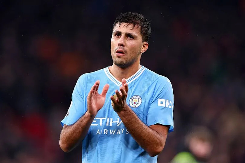 LIVERPOOL, ENGLAND - MARCH 10: Rodri of Manchester City reacts as he applauds the fans at full time during the Premier League match between Liverpool FC and Manchester City at Anfield on March 10, 2024 in Liverpool, England.(Photo by Robbie Jay Barratt - AMA/Getty Images)