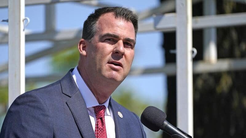 In this May 7, 2021, file photo, Oklahoma Gov. Kevin Stitt speaks during an Oklahoma Law Enforcement Memorial Ceremony in Oklahoma City. Oklahoma is making voting slightly easier, a contrast to other Republican-led states. (AP Photo/Sue Ogrocki File)