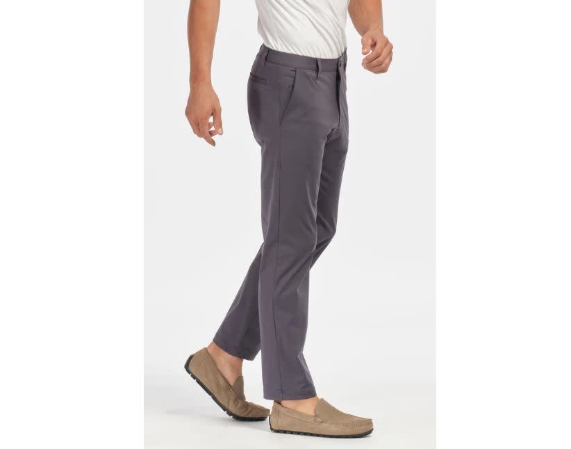 These Rhone Commuter Pants are on <a href="https://www.huffpost.com/entry/most-comfortable-mens-dress-pants_n_5b31338ce4b00295f15f8c41" target="_blank" rel="noopener noreferrer">our list of men's most comfortable work pants</a>. (Photo: Rhone)